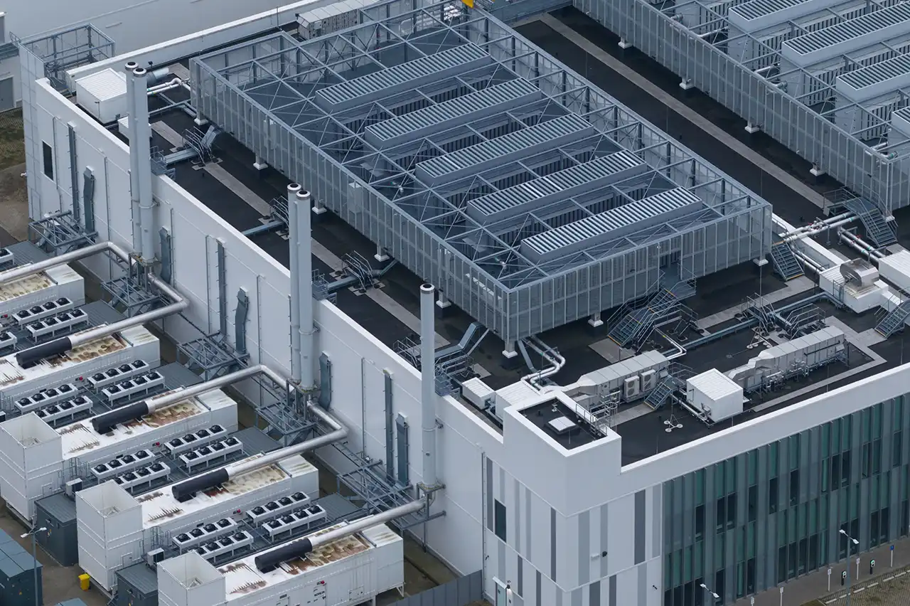 Aerial view of a data center with rooftop cooling equipment and exterior mechanical systems